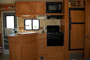 The kitchen in our 27' Fleetwood Prowler Lynx 270FQS travel trailer was a little small for our fulltime RV lifestyle