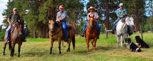 Ranchers on horseback in the Bitterroot Valley, Montana