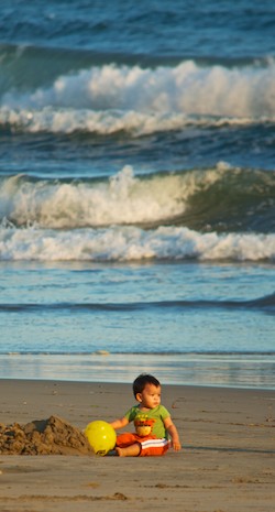 Toddler with a ball at Playa La Bocana Huatulco