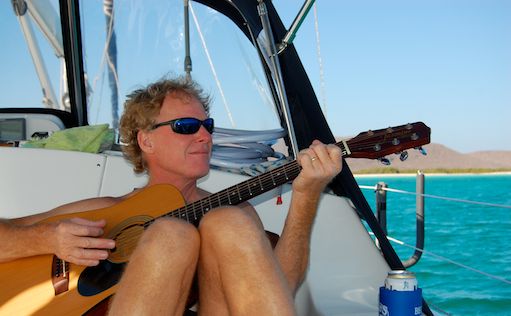 playing guitar on a boat
