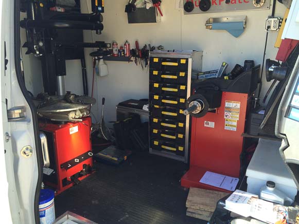 Interior of a mobile mechanic van providing tire replacement service