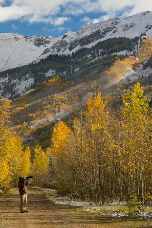 Photographer taking photos in Colorado fall foliage