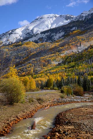 Colorado Mountain stream with snow in autumn