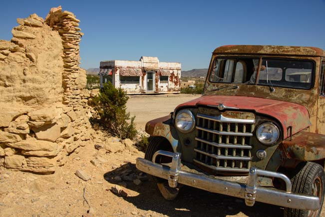 Rusty car and old building in Terlingua