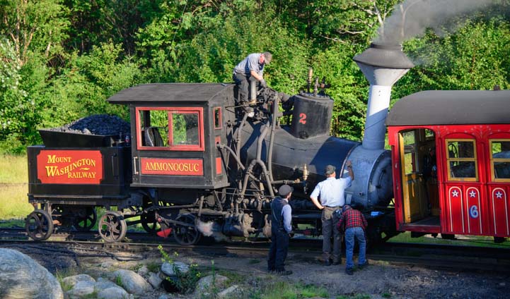 The Cog Railway crew inspects the coal fired steam engine train