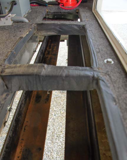 Angle iron supports under an RV fifth wheel battery bank