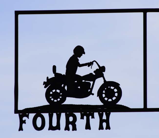 Motorcycle metal art street sign in Tatum New Mexico