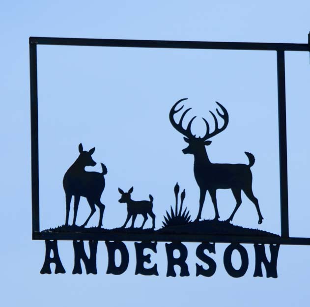 Deer metal art street sign on Anderson St Tatum NM