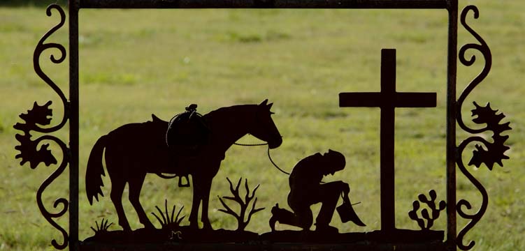 Cowboy horse and cross metal art fence Tatum New Mexico