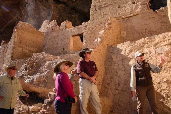 Volunteer National Park Service Guide leads tour Tonto National Monument