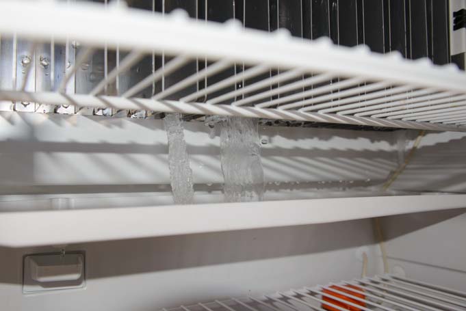 How to defrost an RV refrigerator ice dropping from fridge cooling fins