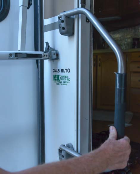 How to set up RV awning - Close RV door handle
