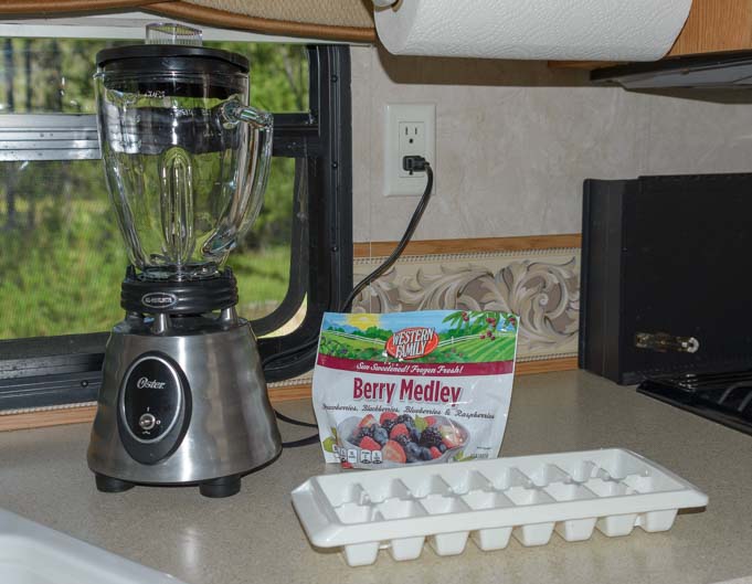 Osterizer blender and frozen berries for smoothie to keep cool in RV in summer