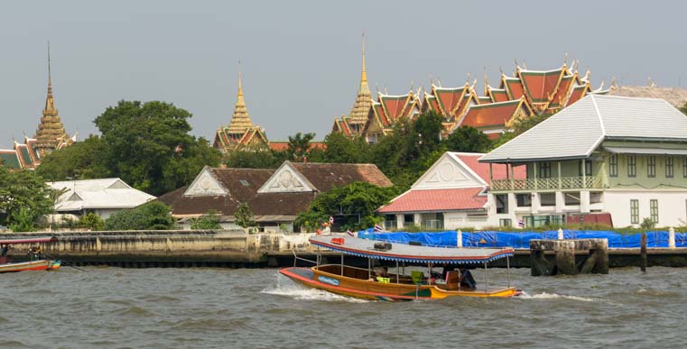 Boat and Grand Palace Chao Phraya River Bangkok Thailand