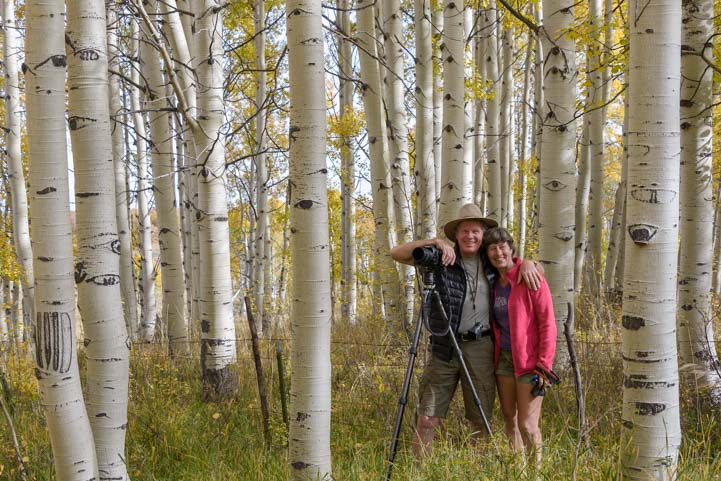 Happy photographers in aspen trees Colorado