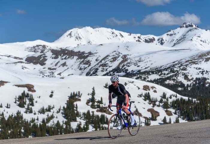 Cyclist on the top of Loveland Pass Colorado