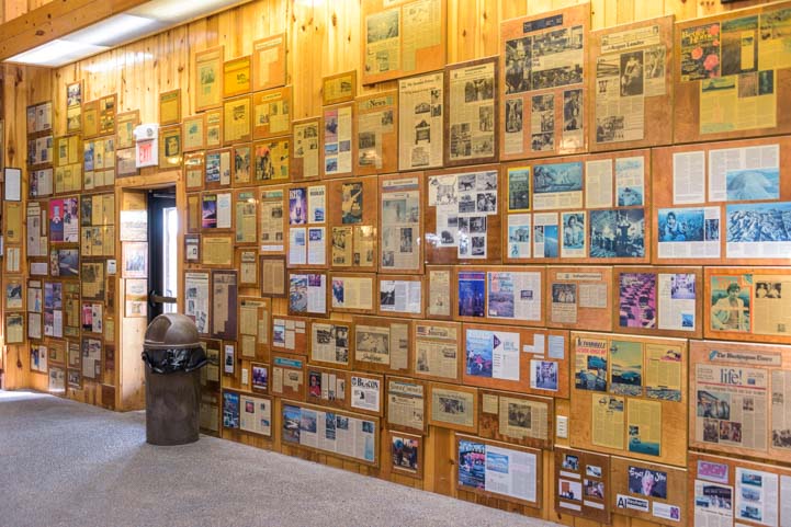 A wall full of newspaper and magazine articles about Wall Drug