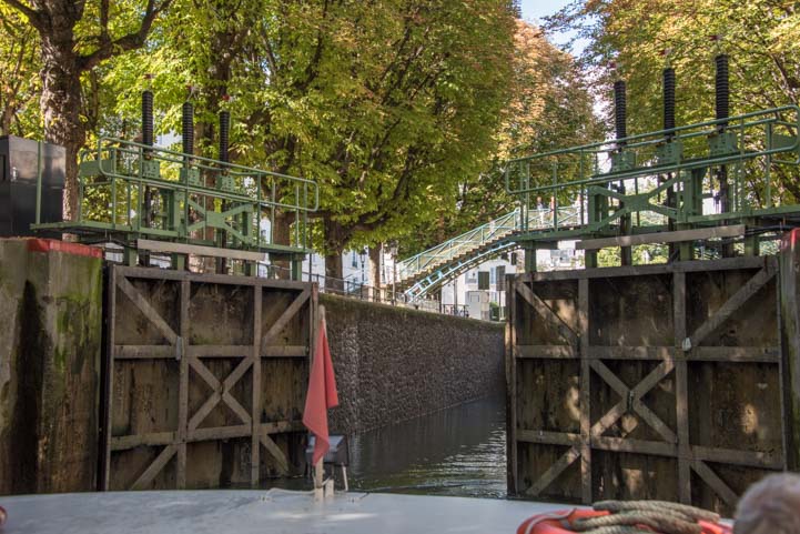 Canal lock doors open on Canauxrama boat ride Paris