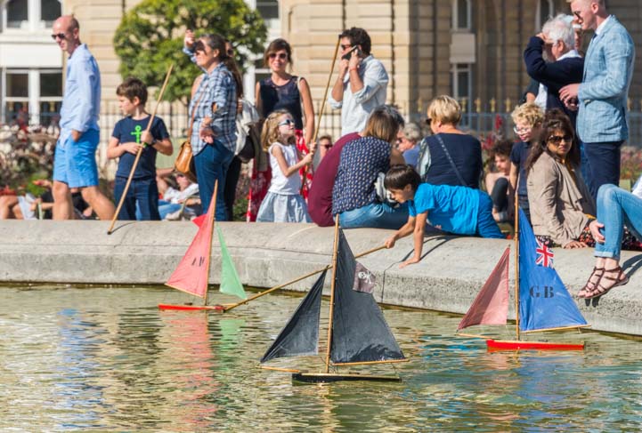Kids play with Sailboats at Luxembourg Garden Paris
