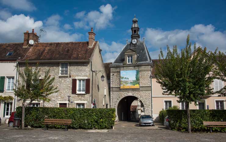 Medieval arch and buildings in Moret sur Loing France-min