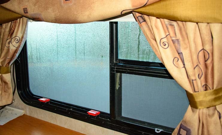 RV windows dripping with condensation in winter-min