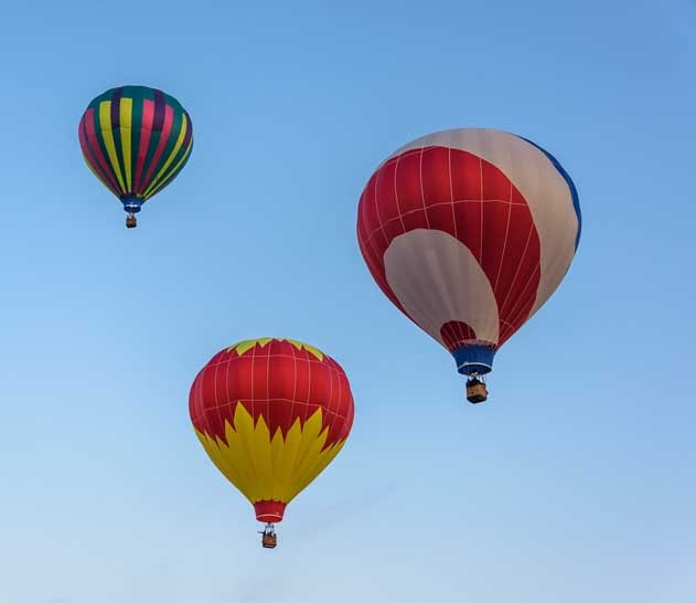 Flying balloons at Fall River Balloon Festival Hot Springs South Dakota-min