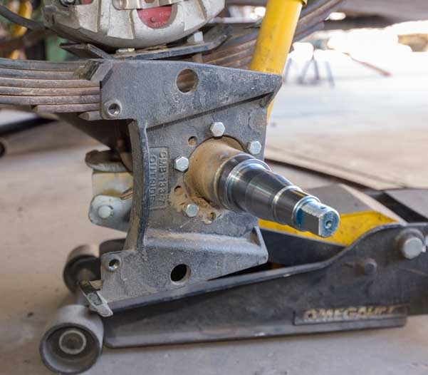 Clean spindle on fifth wheel trailer axle-min