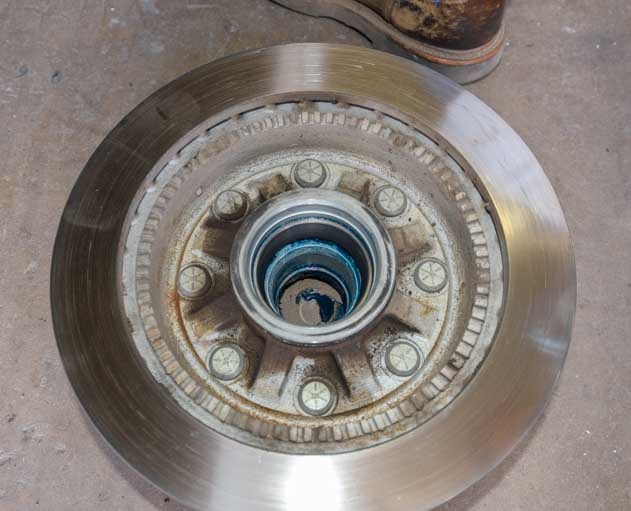 Remove old grease from fifth wheel trailer disc brake hub-min