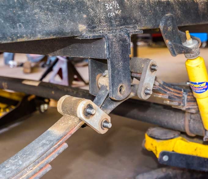 Bolts removed from fifth wheel trailer equalizer to install MorRyde SRE4000-min