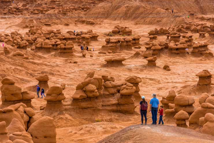 Families hike Valley of the Goblins Goblin Valley State Park Utah RV trip-min