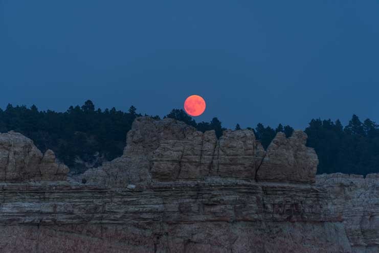 Smoky pink full moon Reva Canyon South Dakota-min