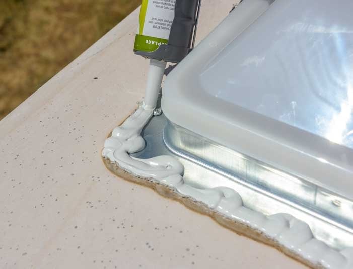 Sealing the new RV roof vent with Dicor Lap Sealant-min