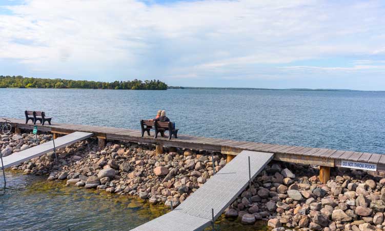 Park bench overlooking Leech Lake in Walker Minnesota-min