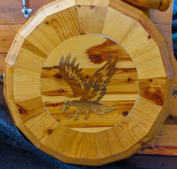 Wooden spare tire cover on a custom woody car built on a Chevy S10 frame-min