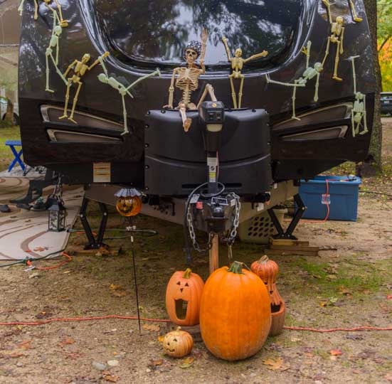 Pumpkins and skeletons on a travel trailer RV-min
