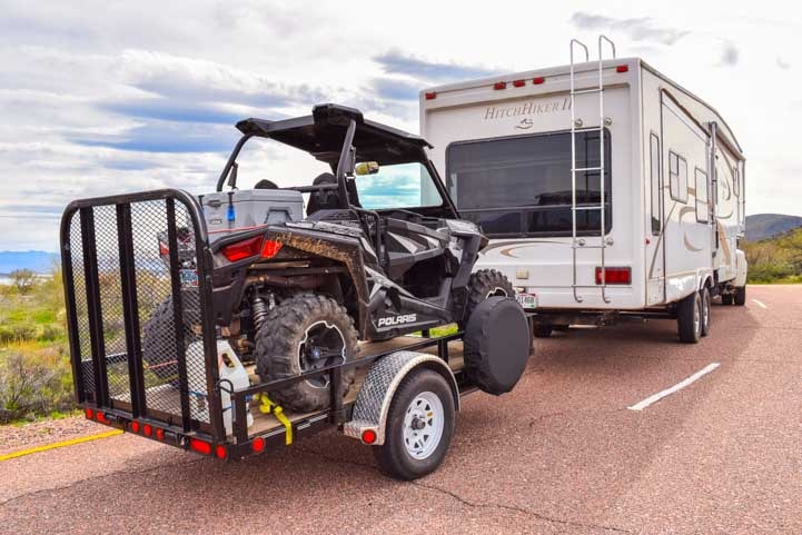 Triple tow Polaris RZR 900 behind fifth wheel trailer-min