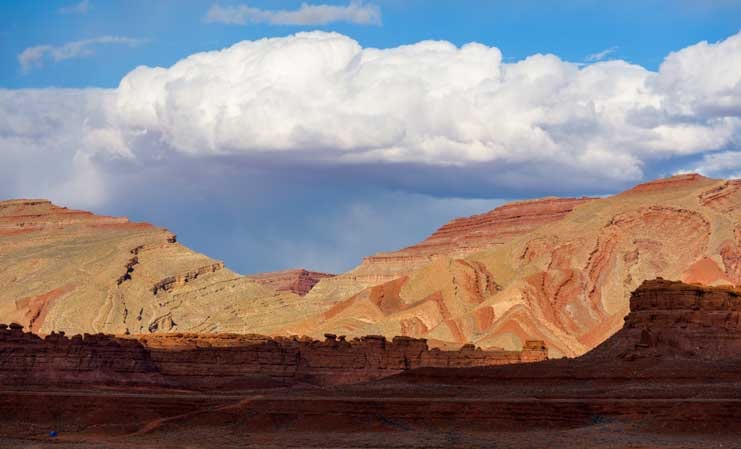 Clouds over red rocks in Utah-min