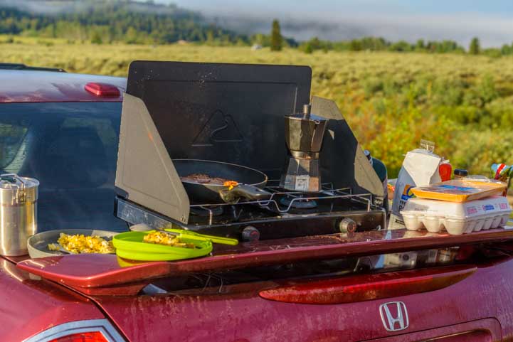 Breakfast cooking on the back of a car atGrand Teton National Park Wyoming