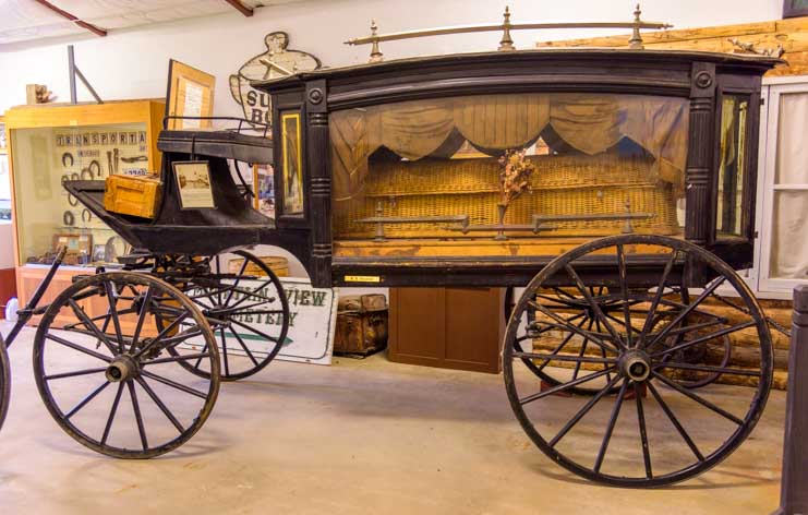Horse drawn hearse in Grand Encampment Museum Livery building