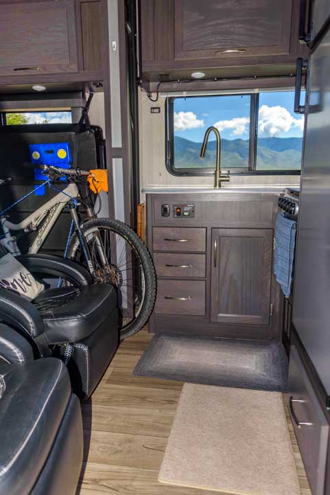 Toy hauler kitchen with the side-by-side UTV RZR loaded