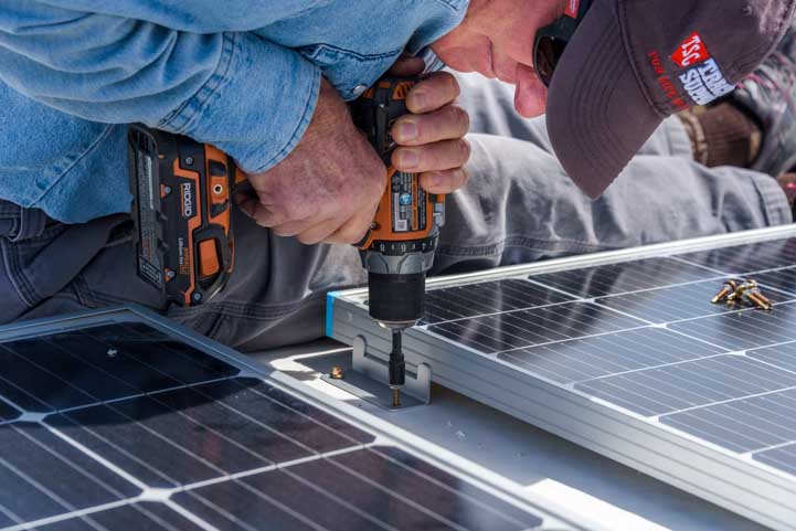 RV solar panel installation- attaching the solar panels to the roof
