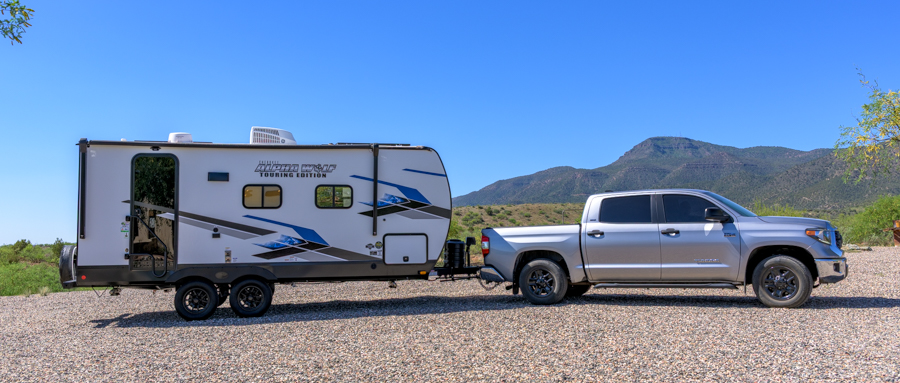 2021 Toyota Tundra towing a 2024 Forest River Alpha Wolf 17CB trailer