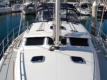 On a cruising sailboat it is essential to have large uncluttered decks.  s/v Groovy deck.